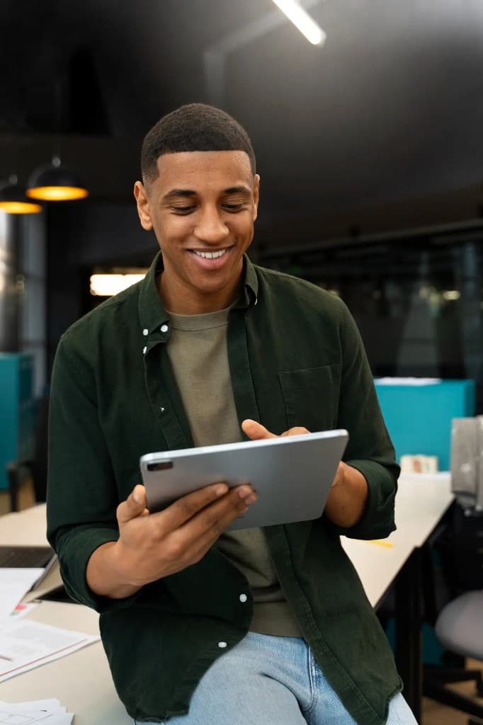 Youth leader reviewing reports on a tablet